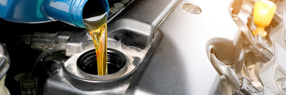 Pouring oil in a car