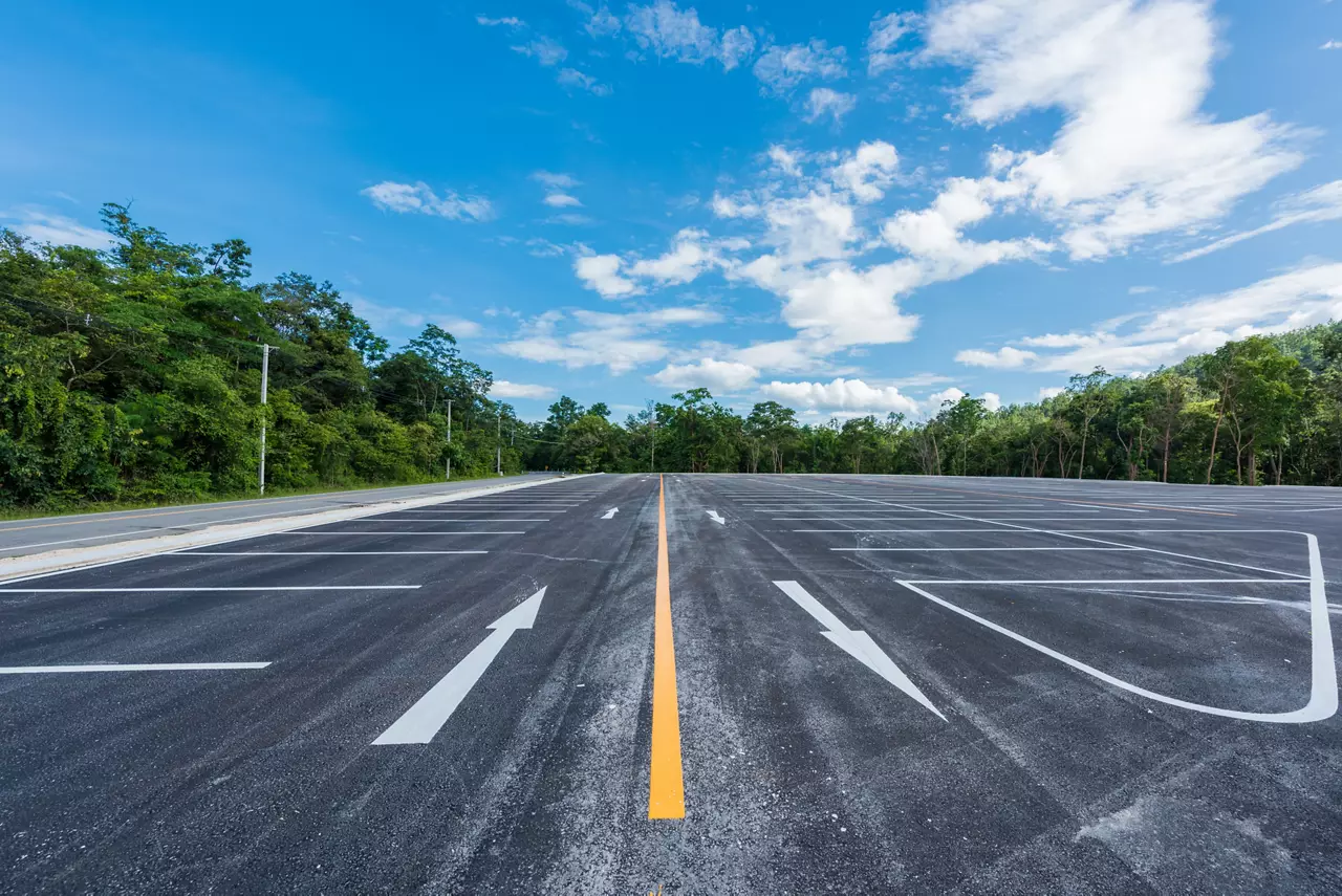 Empty space parking lot outdoor in public park.