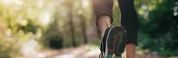 Closeup of running shoe of the person running.