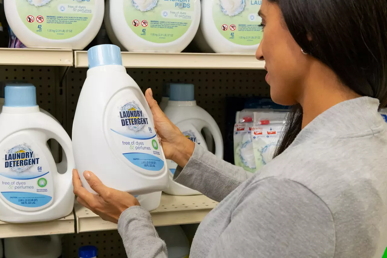 Women holding laundry detergent rigid packaging 