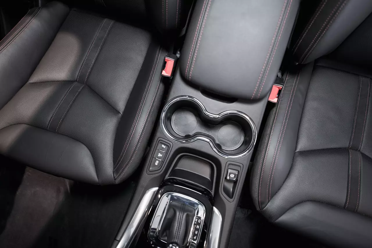 Drink carrier in front interior of car seats